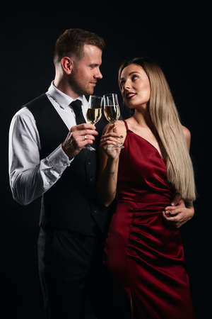 young happy woman and man celebrating New year holiday. celebration, festive time . pleasure conceptの写真素材