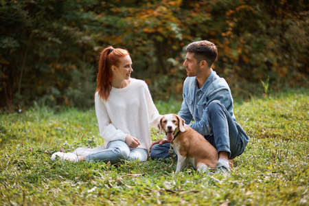young romantic couple enjoying spending time in the fresh air,amorous people enjoying company, date, full length photoの写真素材