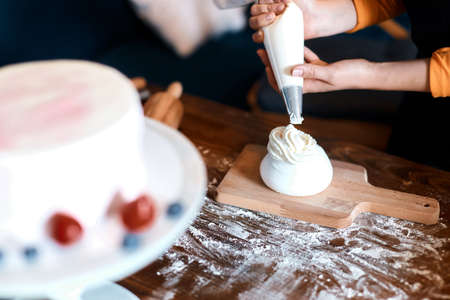 blurred foreground, hardworking creative chef cooking in the kitchen, close up cropped photoの写真素材