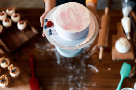 woman going to treat her family with dessert. top view photo.の写真素材