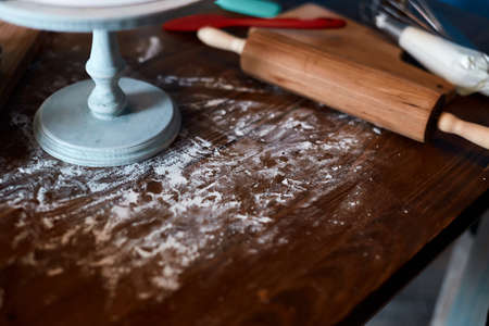 messy kitchen table after baking cake, close up cropped photo.の写真素材
