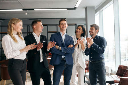 Business team celebrating their co-woker with promotion, happiness, business people congratulating...