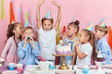 crazy happy atmosphere, mood during the party, close up photo, isolated pink background, studio shot