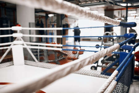 professional boxing ring . close up cropped photo. gym with modern interior. blurred foreground.empty gymの写真素材