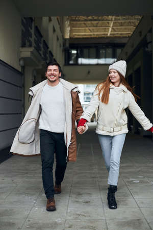 positive cheerful young people spending time in the street, enjoying time, full length photo. togetherness, friendship. family,love is all we needの写真素材