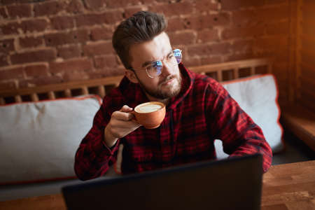 serious man looking aside with thoughtfully, pensive expression, man thinks about business problem, solving problems. close up photoの写真素材