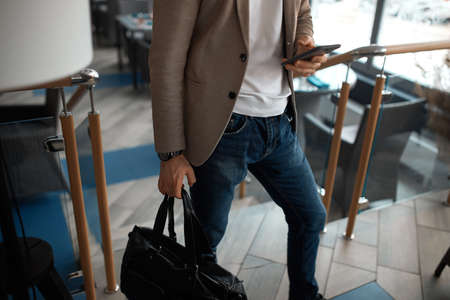 guy sending message, texting e-mail, close up cropped photo, tecnology, mobile addictionの写真素材