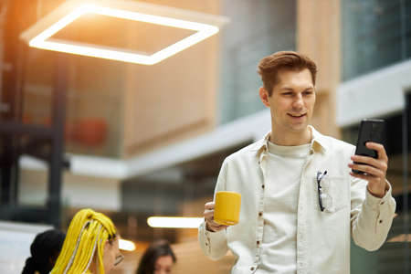 cheerful young man making a phone call to his girlfriend, close up photo. copy space. love, gadget,...