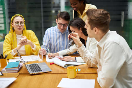 hardworking team trying to reach goals together, togetherness, close up photo. young people...