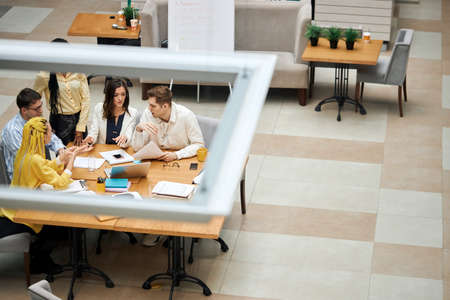 young strart up team overcoming probelms, searching solution, tiop view shot. copy space