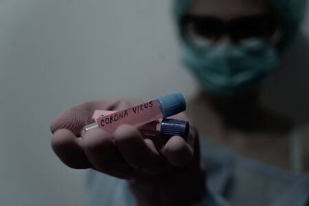 Concept of coronavirus quarantine. MERS-Cov. Novel coronavirus (2019-nCoV). Positive Coronavirus test blood sample. 2019-nCoV pandemicの写真素材