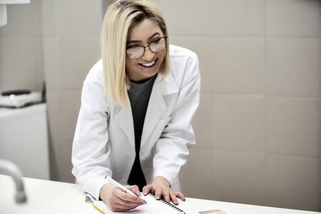 Multicurtural laboratory scientist students working at lab with test tubes