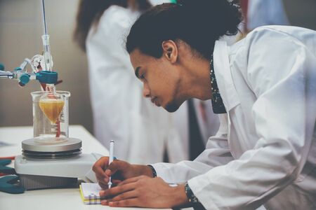 Multicurtural laboratory scientist students working at lab with test tubes
の写真素材