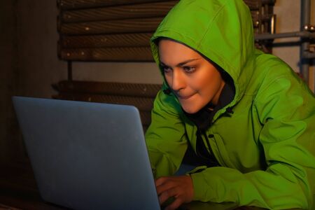 Young Female Hacker Breaks into Corporate Data Servers from His Underground Hideout. Place Has Dark...