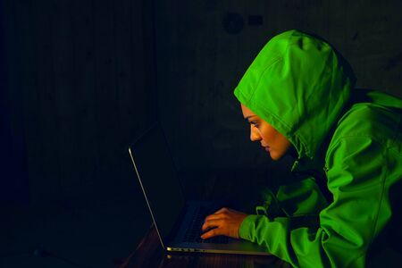 Young Female Hacker Breaks into Corporate Data Servers from His Underground Hideout. Place Has Dark...