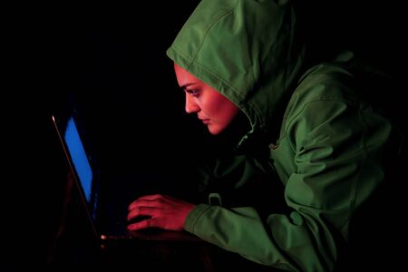 Young Female Hacker Breaks into Corporate Data Servers from His Underground Hideout. Place Has Dark...