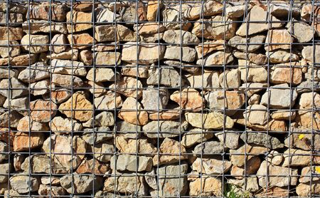 Stone wall with iron barsの写真素材