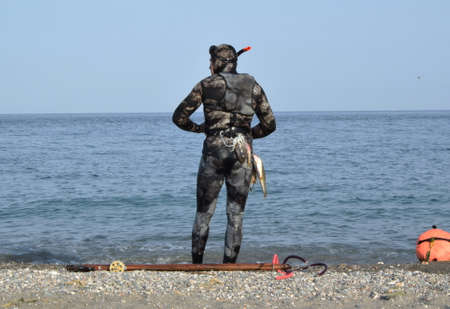 a sub on the sea shore with fish caughtの写真素材