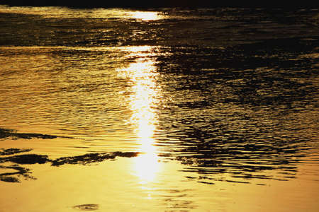 reflection of the sunset on the riverの写真素材