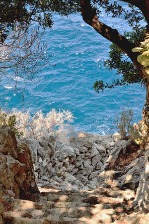 Stone downstairs to the sea / oceanの写真素材