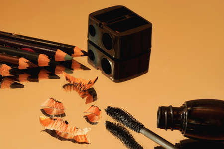 Eye pencils, sharpener, mascara and Their reflection in the mirrorの写真素材