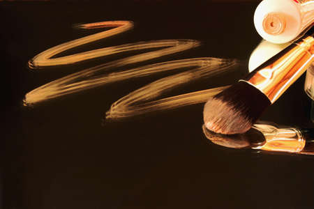 Fluid foundation to brush and Their reflection in the mirrorの写真素材