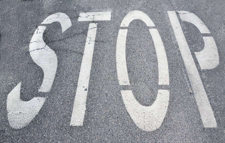 Stop sign on asphalt