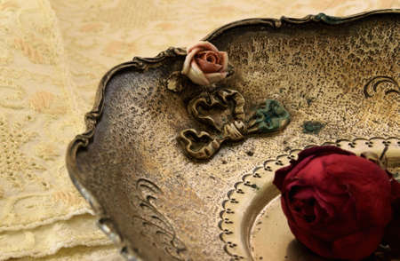 Part of an antique plate with a rose insideの写真素材