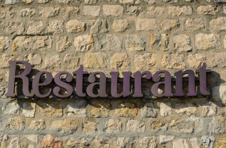 Written "Restaurant" on the stone wallの写真素材