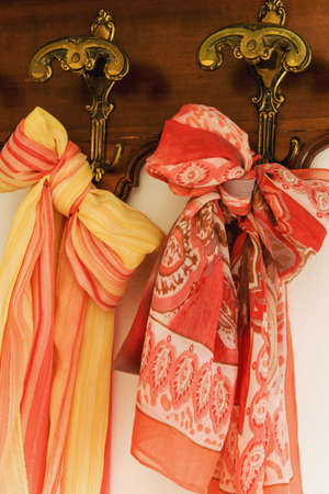 Colored scarves on antique hangerの写真素材