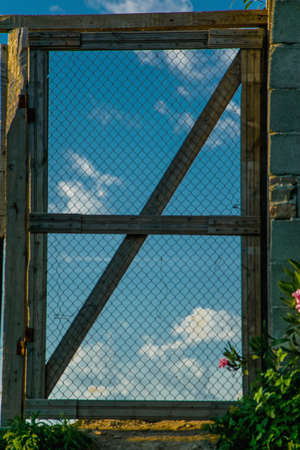 Closed door with sky viewの写真素材