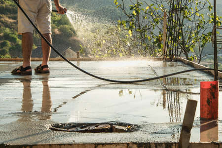 Pouring water on reinforcement cementの写真素材