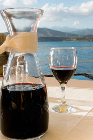 Drinking red wine in the open-air restaurantの写真素材