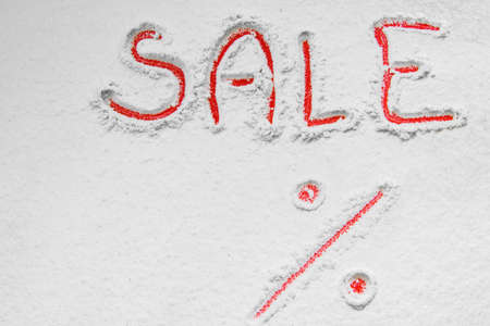 Written "SALE%" on the snowの写真素材
