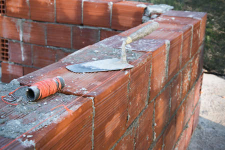 Red brick wall in constructionの写真素材