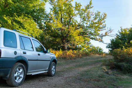 Traveling in the mountains with off road vehicleの写真素材