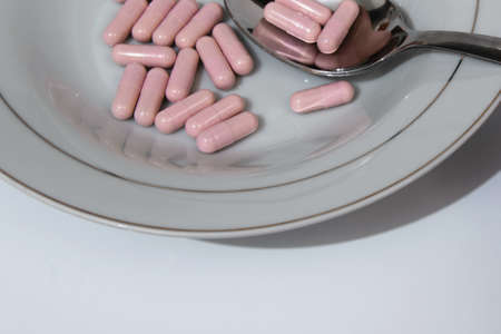 Pink pills in the plate