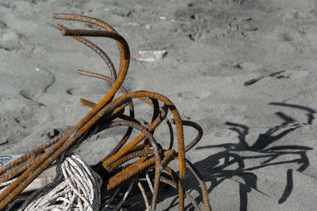 Old anchors on the sandy beachの写真素材