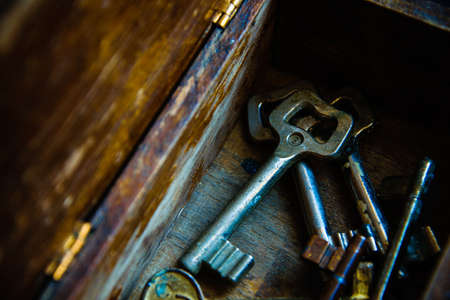 Old keys in the antique wooden boxの写真素材