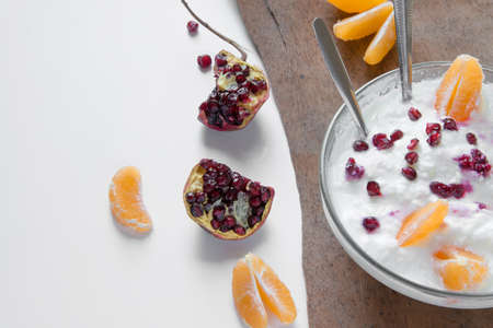 Top view of fresh fruits and yogurt for breakfast or snack with space for text. Healthy eating conceptの写真素材