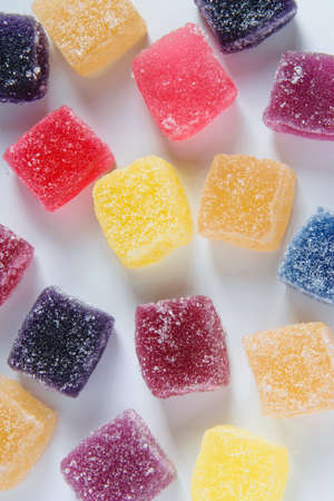 Sweet background by yummy jelly candies on white backgroundの写真素材