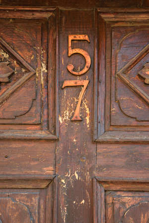 Close Up of antique wooden door number 57の写真素材