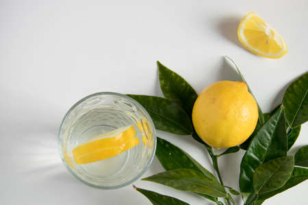 Glass of water with lemon slices on white background, space for textの写真素材
