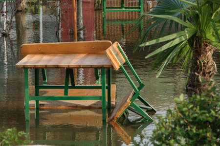 The increased level of water from rains in the front yard house, concept - bad weather conditionsの写真素材