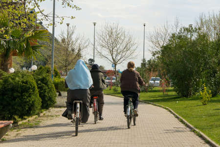 Shkoder/Albania - 04.06.2018: People riding bicycle in the city parkのeditorial素材