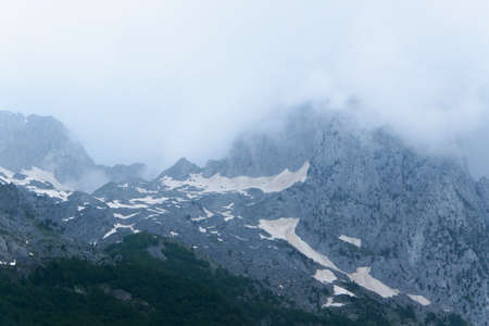 Nature landscape of mountain cloudy peaks. Concept - the weather changes quickly in the high...