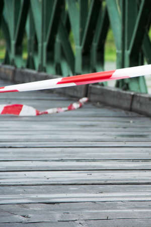 White and red warning line on the old bridgeの写真素材