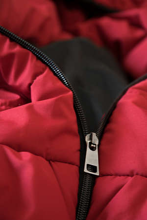 Close up of red down jacket, winter fashion outfitの写真素材