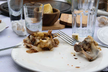 Messy table with empty dirty dishes after eating