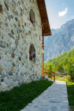 Detail of stone road in front of stone house on the background of high mountainsのeditorial素材